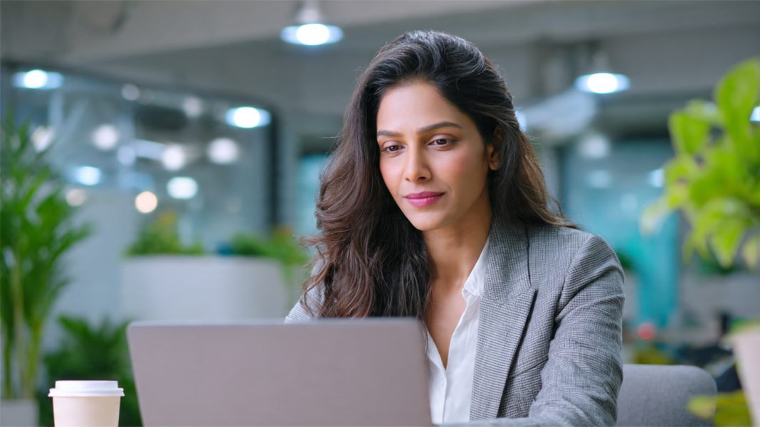 Indian female entrepreneur evaluating professional email hosting services for her startup at agmwebhosting.in